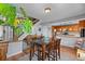 Inviting dining area with stairway view, perfect for relaxed meals and entertaining at 8544 S Upham Way, Littleton, CO 80128