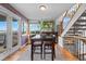 Bright dining area with wood floors and walk-out patio, perfect for entertaining or relaxed meals at 8544 S Upham Way, Littleton, CO 80128