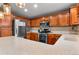 Stylish kitchen featuring stainless steel appliances and a large counter perfect for cooking at 8544 S Upham Way, Littleton, CO 80128