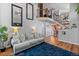 Spacious living room showcases an open floor plan, grand staircase, and stylish decor at 8544 S Upham Way, Littleton, CO 80128