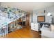 Spacious upper floor layout with office space and stairway access, creating a seamless flow at 8544 S Upham Way, Littleton, CO 80128