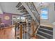 Comfortable living space with access to dining area and staircase, providing seamless flow throughout the home at 8544 S Upham Way, Littleton, CO 80128