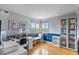 Cozy office with views of the landscape, built-in storage, and hardwood flooring for a productive atmosphere at 8544 S Upham Way, Littleton, CO 80128