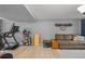 Bright workout area featuring modern exercise equipment and wood-look vinyl flooring at 8544 S Upham Way, Littleton, CO 80128