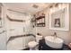 Chic bathroom features glass enclosed shower and sleek black vanity with vessel sink at 10872 W Evans Ave # 3D, Lakewood, CO 80227