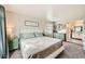Serene bedroom featuring neutral tones, mountain view, and ample closet space at 10872 W Evans Ave # 3D, Lakewood, CO 80227