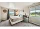 Inviting bedroom with mountain views, a comfortable bed, and neutral decor at 10872 W Evans Ave # 3D, Lakewood, CO 80227
