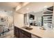 Modern kitchen with sleek countertops, stainless steel appliances, and an open view to the living space at 10872 W Evans Ave # 3D, Lakewood, CO 80227