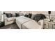 Relaxing living room boasting an oversized sectional sofa with plush pillows at 10872 W Evans Ave # 3D, Lakewood, CO 80227