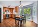 The spacious kitchen features stainless steel appliances, wood cabinetry, and sliding doors leading to backyard at 12653 Jersey E Cir, Thornton, CO 80602