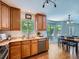This spacious kitchen provides lots of natural light and has stainless steel appliances and backyard access at 12653 Jersey E Cir, Thornton, CO 80602