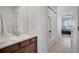 Bathroom with vanity, white sink, and shower over tub at 87 Green Fee Cir, Castle Pines, CO 80108