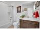 Bathroom featuring a tub, shower, vanity with wood cabinets, and a mirrored medicine cabinet at 87 Green Fee Cir, Castle Pines, CO 80108