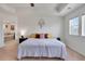 Spacious Primary bedroom featuring neutral walls, carpet, and windows with views of the surrounding neighborhood at 87 Green Fee Cir, Castle Pines, CO 80108