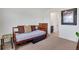Bedroom featuring a wooden daybed and carpet flooring at 87 Green Fee Cir, Castle Pines, CO 80108