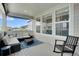 Relaxing covered deck with comfortable seating and ample natural light, great for outdoor living at 87 Green Fee Cir, Castle Pines, CO 80108