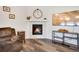 Living room features a modern fireplace with stylish decor and hardwood floors at 87 Green Fee Cir, Castle Pines, CO 80108