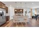 Charming kitchen boasts granite countertops, stainless steel appliances, and an inviting breakfast bar seating area at 87 Green Fee Cir, Castle Pines, CO 80108