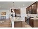 Open kitchen showcasing an island with bar seating and stainless steel appliances at 87 Green Fee Cir, Castle Pines, CO 80108