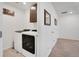 Hallway with laundry room with modern washer and dryer at 87 Green Fee Cir, Castle Pines, CO 80108