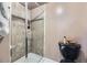 Updated bathroom with tiled shower, glass door, and modern fixtures plus black toilet at 6338 S Oneida Ct, Centennial, CO 80111