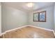 Bright, airy bedroom with hardwood floors, window and neutral paint color at 6338 S Oneida Ct, Centennial, CO 80111