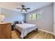Bedroom featuring hardwood floors, grey walls, ceiling fan, and window at 6338 S Oneida Ct, Centennial, CO 80111