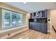 Cozy breakfast nook with built-in storage and a large window overlooking the front yard at 6338 S Oneida Ct, Centennial, CO 80111