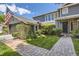 Lovely home featuring stone pathway, beautiful landscaping, and a charming entryway at 6338 S Oneida Ct, Centennial, CO 80111