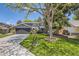 Charming two-story home with a well-manicured lawn, mature trees, and a two-car garage at 6338 S Oneida Ct, Centennial, CO 80111