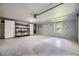 Clean and organized garage with epoxy flooring, storage cabinets, and ample space at 6338 S Oneida Ct, Centennial, CO 80111