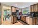 Updated kitchen with granite counters, stainless appliances and wood cabinets at 6338 S Oneida Ct, Centennial, CO 80111