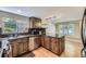 Bright kitchen featuring stainless steel appliances, granite counters, and hardwood floors at 6338 S Oneida Ct, Centennial, CO 80111