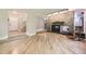 View of the living area highlighting the stone fireplace and hardwood floors at 6338 S Oneida Ct, Centennial, CO 80111