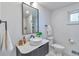 Stylish bathroom with modern fixtures, a unique vessel sink, and ample natural light at 2598 Teller St, Lakewood, CO 80214