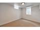 This room features neutral carpet, white walls, and a window at 2598 Teller St, Lakewood, CO 80214