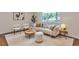 Cozy living room with stylish furniture, neutral tones, and bright natural lighting at 2598 Teller St, Lakewood, CO 80214