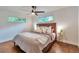 Bright main bedroom featuring a large window and a ceiling fan at 2598 Teller St, Lakewood, CO 80214