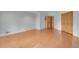 A spacious bedroom with hardwood floors and double-door closets at 29433 Firethorne Ct, Evergreen, CO 80439