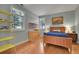 Bedroom with hardwood floors, ample natural light, and a modern design at 29433 Firethorne Ct, Evergreen, CO 80439