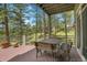 Deck with wood table and chairs with amazing tree views at 29433 Firethorne Ct, Evergreen, CO 80439