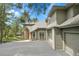 Exterior view displaying the driveway and stone architectural accents at 29433 Firethorne Ct, Evergreen, CO 80439