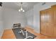 Bright exercise room featuring a weight bench, free weights, and wood floors at 29433 Firethorne Ct, Evergreen, CO 80439