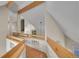 Hallway with wooden railings, modern design, and hardwood floors at 29433 Firethorne Ct, Evergreen, CO 80439
