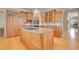 Chef's kitchen with center island and custom cabinetry, offers a functional space for culinary creativity at 29433 Firethorne Ct, Evergreen, CO 80439