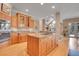 Spacious kitchen with hardwood floors, a kitchen island, and custom cabinetry offering a modern and luxurious culinary experience at 29433 Firethorne Ct, Evergreen, CO 80439