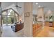 Open floor plan with granite kitchen and living room with deck access at 29433 Firethorne Ct, Evergreen, CO 80439