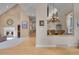 Open-concept living room featuring a fireplace, hardwood floors, and a dining area at 29433 Firethorne Ct, Evergreen, CO 80439