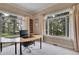 Home office with natural light and large windows overlooking the yard at 29433 Firethorne Ct, Evergreen, CO 80439