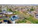 Wide aerial view of a suburban neighborhood featuring well-maintained homes and mature trees at 4465 E 121St Pl, Thornton, CO 80241